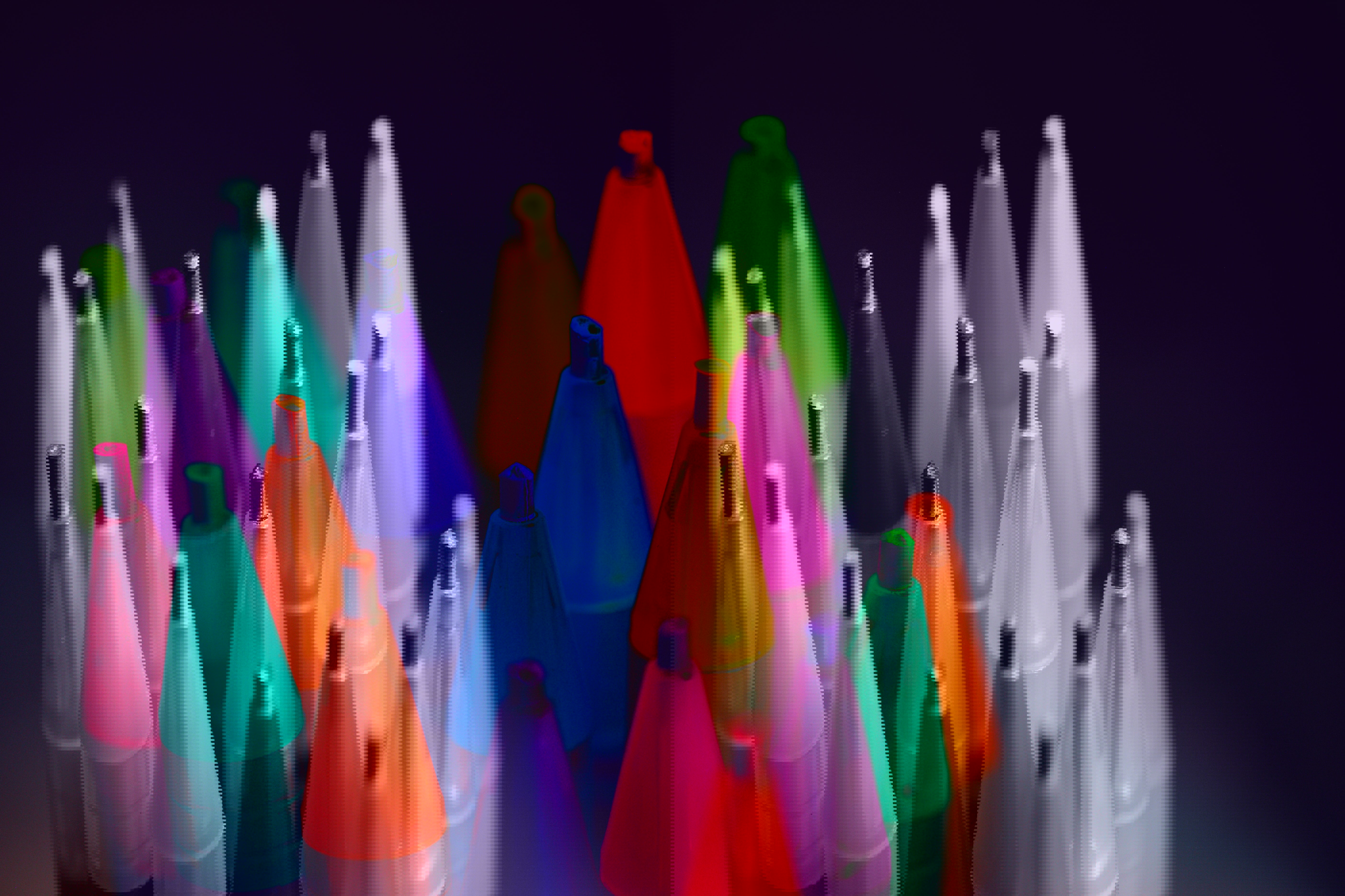 Colorful highlighters in various shades, standing upright and grouped in a circle.